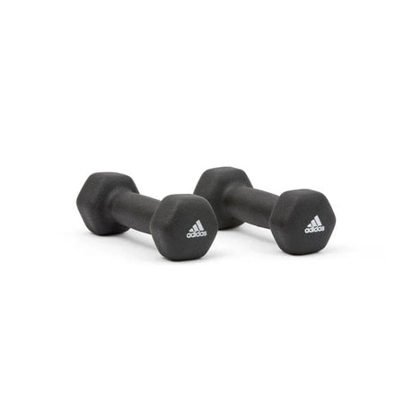 Pair of black Adidas hexagonal dumbbells on white background for strength training