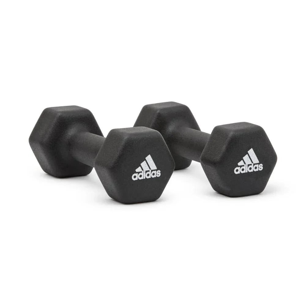 Pair of black Adidas hex dumbbells with white logos on a white background
