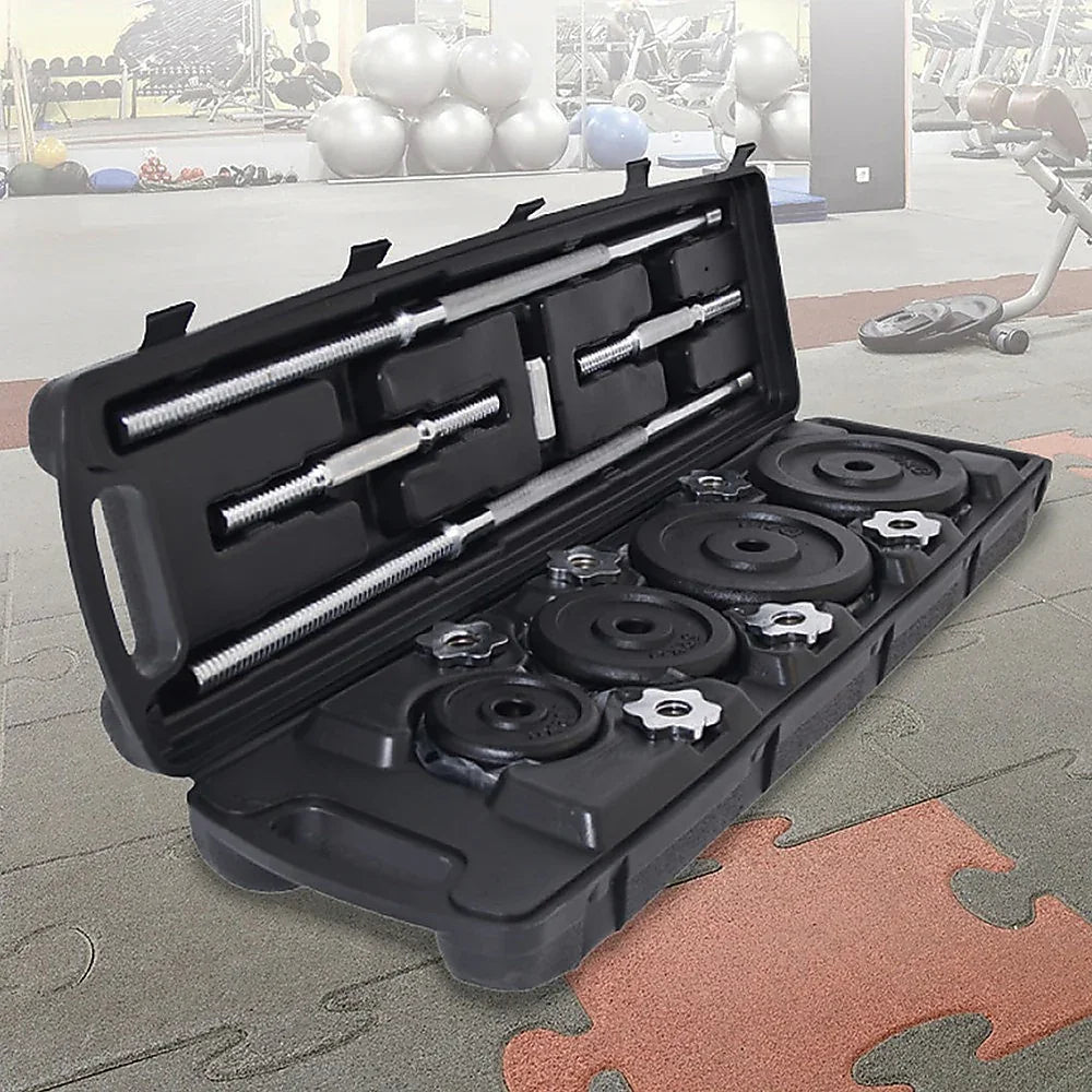 Adjustable dumbbell weight set in black case on gym floor with exercise balls and equipment in background