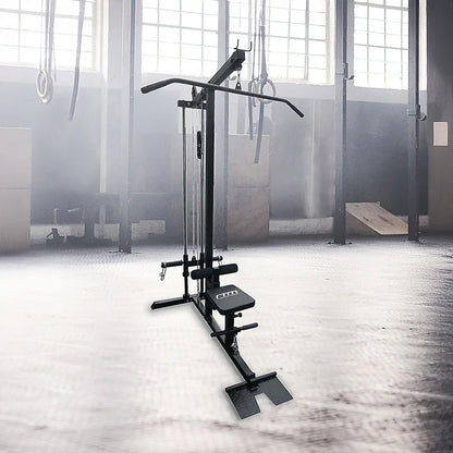 Lat pulldown machine in a gym with large windows and gymnastic rings