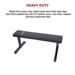 Heavy-duty flat weight bench with padded PU leather top and rubberized feet on white background.