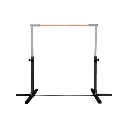 Adjustable metal ballet barre with wooden top and black base on a black background