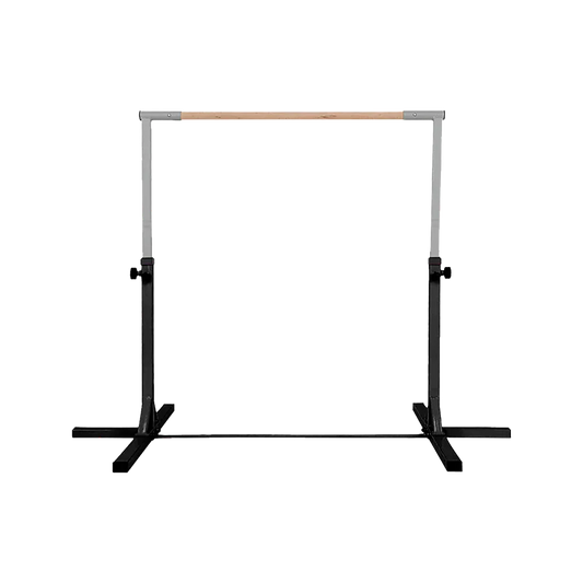 Adjustable metal ballet barre with wooden top and black base on a black background