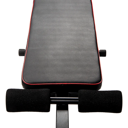 Adjustable weight bench seat with black padding and red trim for home gym workouts