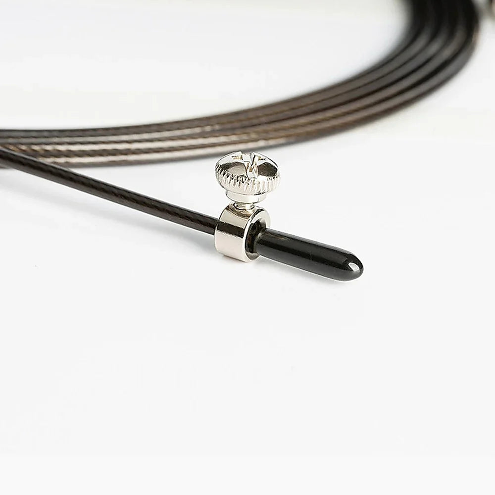 Close-up of guitar string with silver screw and black ball-end on white background