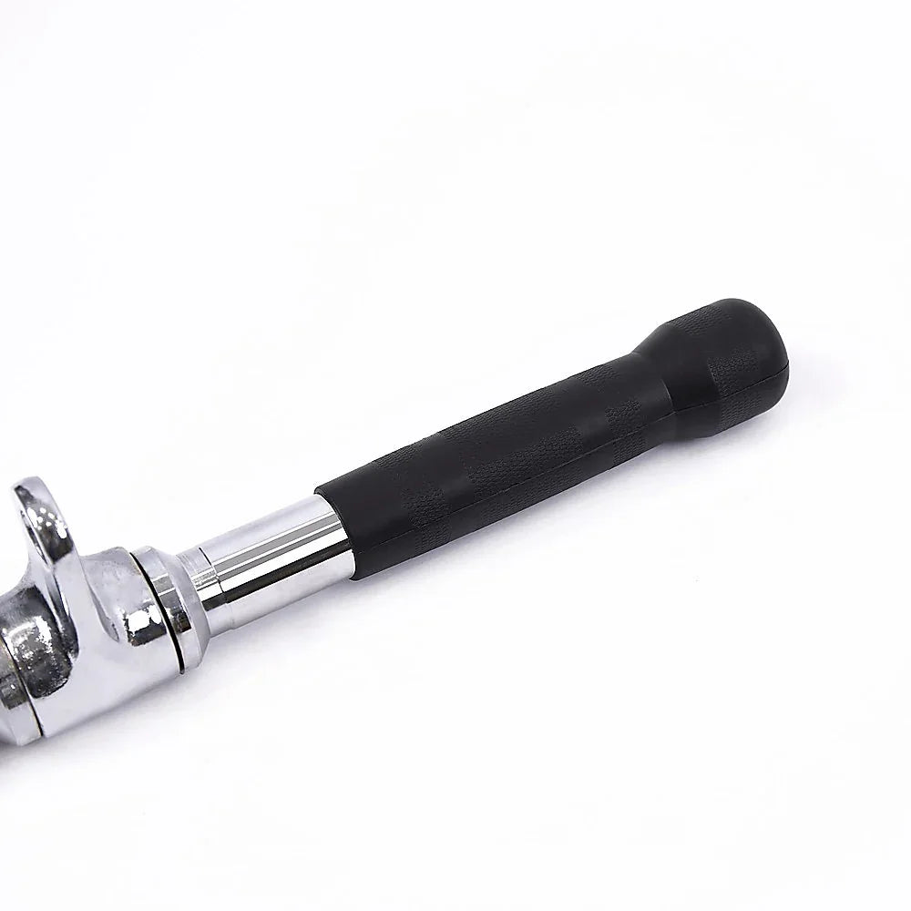 Close-up of a chrome ratchet wrench with a black rubber handle on white background