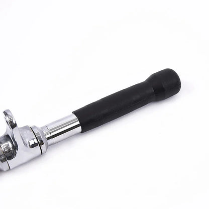 Close-up of a chrome ratchet wrench with a black rubber handle on white background