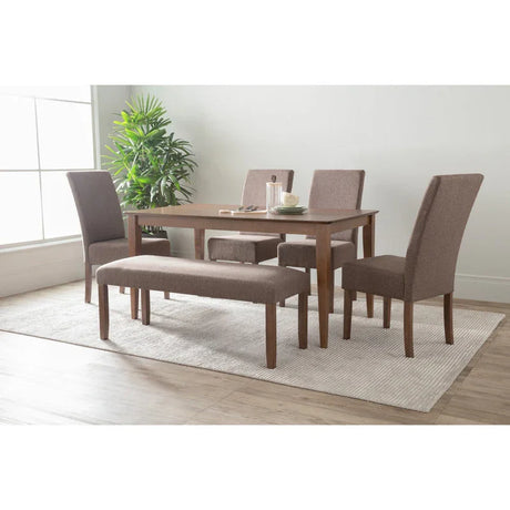 Modern dining room set with brown upholstered chairs, bench, wooden table, and indoor plant
