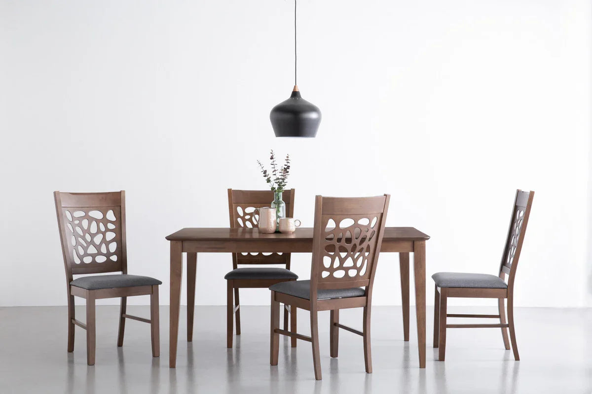 Modern wooden dining table with four chairs and a black pendant light