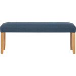 Modern upholstered bench with blue cushion and wooden legs on white background