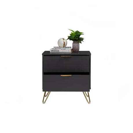 Modern black nightstand with gold legs, two drawers, books, decorative globe, and a potted plant