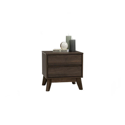 Mid-century modern dark wood nightstand with two drawers, candles, book, and decorative orb