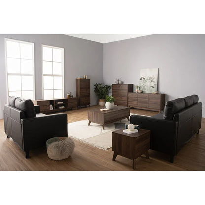 Modern living room with black sofas, walnut wood furniture, and gray walls