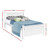 White wooden bed frame with blue blanket and assorted pillows, 118x216 cm size dimensions