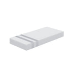 White foam mattress with two gray stripes on one end on a white background