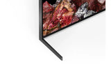 Modern flat-screen TV corner with slim black stand and vibrant gemstone display, Flea Market AU